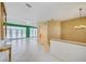 Hallway leading into living room showcasing tile flooring and interior design at 8540 Caitlin Ct, Hudson, FL 34667
