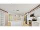 Modern kitchen with stainless steel appliances, white cabinetry and a convenient center island at 8540 Caitlin Ct, Hudson, FL 34667