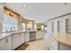 Modern kitchen featuring stainless appliances, ample counter space, and a sink overlooking the backyard at 8540 Caitlin Ct, Hudson, FL 34667