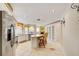 Bright kitchen features an open layout, stainless steel appliances, and a view to the living space at 8540 Caitlin Ct, Hudson, FL 34667