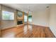 A spacious living room featuring a fireplace, windows, and neutral walls at 8540 Caitlin Ct, Hudson, FL 34667
