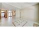 Spacious living room boasts tile floors with decorative details and an open floor plan at 8540 Caitlin Ct, Hudson, FL 34667