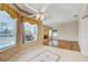 Inviting living room showcasing pool views, tile floors, and a cozy fireplace for relaxation at 8540 Caitlin Ct, Hudson, FL 34667