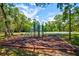 Community playground area featuring climbing structures and swings, a perfect spot for outdoor fun at 8540 Caitlin Ct, Hudson, FL 34667