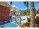 Gated community pool entrance with posted hours and rules for a safe and enjoyable experience at 8540 Caitlin Ct, Hudson, FL 34667