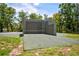 An outdoor racquetball court surrounded by trees and greenery, providing a great recreational amenity at 8540 Caitlin Ct, Hudson, FL 34667