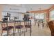 Modern kitchen with white cabinets, stainless steel appliances, and breakfast bar seating at 8811 Napa Loop, New Port Richey, FL 34653