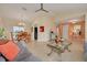 Spacious and open living room and dining area with neutral paint and comfortable furnishings at 8811 Napa Loop, New Port Richey, FL 34653