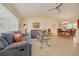 Inviting living room featuring tile flooring, comfortable furniture, and large windows at 8811 Napa Loop, New Port Richey, FL 34653