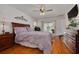 Bright primary bedroom with access to the pool area and elegant decor at 8811 Napa Loop, New Port Richey, FL 34653