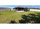 Large, fully fenced backyard featuring a gazebo and screened-in porch at 8855 Prairie Creek Dr, New Port Richey, FL 34655