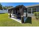 Backyard with gazebo, privacy fence, and partially screened lanai at 8855 Prairie Creek Dr, New Port Richey, FL 34655