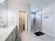 A modern bathroom with a glass-enclosed shower, sleek vanity, and neutral tones creating a spa-like ambiance at 8855 Prairie Creek Dr, New Port Richey, FL 34655