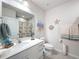 Coastal themed bathroom featuring a vanity with storage and seaside decor at 8855 Prairie Creek Dr, New Port Richey, FL 34655