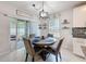 Cozy dining area with a sliding door to the patio at 8855 Prairie Creek Dr, New Port Richey, FL 34655