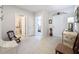 Inviting entryway featuring tile flooring, decorative accents, and views into the bedroom and bathroom at 8855 Prairie Creek Dr, New Port Richey, FL 34655