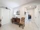 Welcoming foyer with tiled floor, wood accents, and views into other rooms of the home at 8855 Prairie Creek Dr, New Port Richey, FL 34655