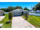 Charming single-Gathering home with a well-manicured lawn and neutral gray exterior at 8855 Prairie Creek Dr, New Port Richey, FL 34655