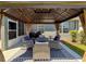 Outdoor gazebo with outdoor seating, lighting, and barbeque grill at 8855 Prairie Creek Dr, New Port Richey, FL 34655