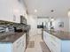 Bright kitchen featuring granite countertops, a pantry and stainless steel appliances at 8855 Prairie Creek Dr, New Port Richey, FL 34655