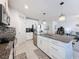 Spacious kitchen with a large island, granite countertops and stainless steel appliances at 8855 Prairie Creek Dr, New Port Richey, FL 34655