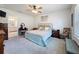 Comfortable bedroom featuring a ceiling fan, neutral paint and carpeted floors at 8855 Prairie Creek Dr, New Port Richey, FL 34655