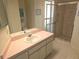 Bathroom with tiled floor and a glass shower at 9168 Southern Comfort Ct, Weeki Wachee, FL 34613