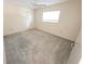 Bright bedroom featuring a ceiling fan, closet and a large window for natural light at 9168 Southern Comfort Ct, Weeki Wachee, FL 34613