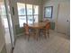 Cozy dining room featuring tile flooring and sliding glass door with natural light at 9168 Southern Comfort Ct, Weeki Wachee, FL 34613