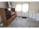 Spacious garage with storage cabinets and a double-door exit to the exterior at 9168 Southern Comfort Ct, Weeki Wachee, FL 34613