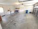 Expansive garage with ample space and storage for vehicles, equipment, and household items at 9168 Southern Comfort Ct, Weeki Wachee, FL 34613