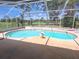 Enjoy this screened-in pool with a golf course view, perfect for outdoor relaxation and entertainment at 9168 Southern Comfort Ct, Weeki Wachee, FL 34613
