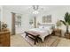 Bright bedroom with natural light, neutral decor, and decorative rug at 9420 Georgian Park Ln # 106, Tampa, FL 33626