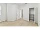 Bedroom features open closet and a door that leads to an adjacent room at 9420 Georgian Park Ln # 106, Tampa, FL 33626