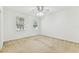 Spacious bedroom with large windows and neutral carpeting at 9420 Georgian Park Ln # 106, Tampa, FL 33626
