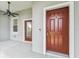 Front porch featuring a ceiling fan and exterior doors to the house at 9420 Georgian Park Ln # 106, Tampa, FL 33626