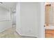 Upstairs hallway with carpet and access to a bathroom at 9420 Georgian Park Ln # 106, Tampa, FL 33626