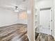 Spacious living room with wood-look flooring, bright white walls, and open layout at 9420 Georgian Park Ln # 106, Tampa, FL 33626