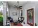 Inviting porch with comfortable seating, fan, and outdoor view at 9420 Georgian Park Ln # 106, Tampa, FL 33626