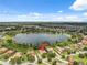 Aerial view showcases the property's lakeside location and scenic neighborhood surroundings at 9829 Sorbonne Loop, Seffner, FL 33584