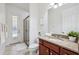 Bathroom with granite vanity, modern fixtures, and a glass shower, plus access to the pool area at 9829 Sorbonne Loop, Seffner, FL 33584