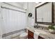 Cozy bathroom features granite countertops, a decorative mirror, and a shower with a stylish curtain at 9829 Sorbonne Loop, Seffner, FL 33584