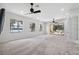 Spacious bonus room boasts large windows with lake views and access to the outdoor patio area at 9829 Sorbonne Loop, Seffner, FL 33584