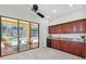 Bonus room with wet bar opens to a screened lanai and a beautiful swimming pool and spa area at 9829 Sorbonne Loop, Seffner, FL 33584