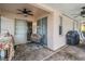 Covered patio features brick flooring, a ceiling fan, and sliding glass doors to the interior at 10435 Peppergrass Ct, Trinity, FL 34655
