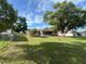 The home's large backyard provides ample space, complemented by mature trees and privacy fencing at 10458 Clingman St, Spring Hill, FL 34608