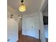 Hallway featuring hardwood floors, access to the living areas, and ample closet space at 10458 Clingman St, Spring Hill, FL 34608