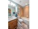 Full bathroom featuring a vanity with white countertop and a tub with tile surround at 10925 Oyster Bay Cir, New Port Richey, FL 34654