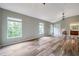 Bonus room with modern floors, multiple large windows, and decorative lighting fixtures at 10925 Oyster Bay Cir, New Port Richey, FL 34654