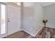 Welcoming foyer with wood-look flooring, neutral paint, and a front door with sidelight at 10925 Oyster Bay Cir, New Port Richey, FL 34654